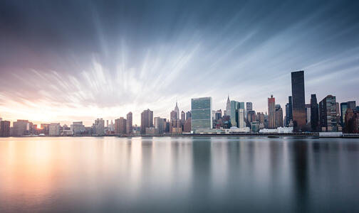 city skyline sun rising in the background Thumbnail